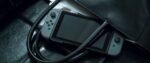 Nintendo Switch-Konsole mit zwei kabellosen Joy-Con-Controllern in Rot und Neonblau V3 – Bild 6