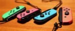 Nintendo Switch-Konsole mit zwei kabellosen Joy-Con-Controllern in Rot und Neonblau V3 – Bild 7