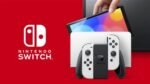 Nintendo Switch (OLED-Modell) mit Dockingstation und weißen Joy-Con-Controllern – Bild 3